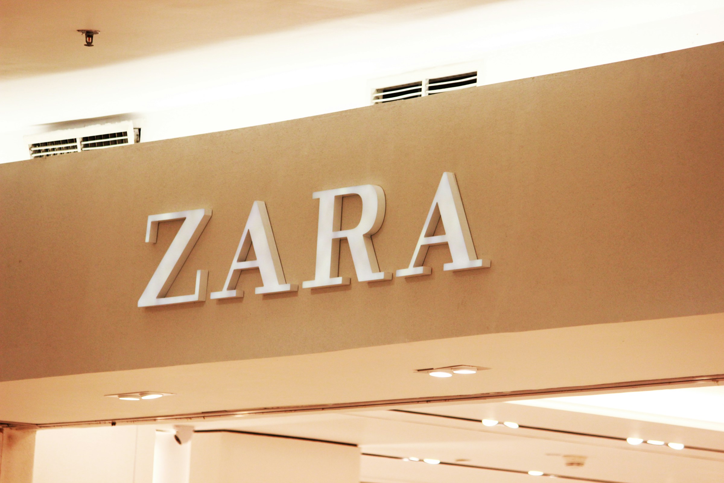 ZARA storefront sign inside a shopping center